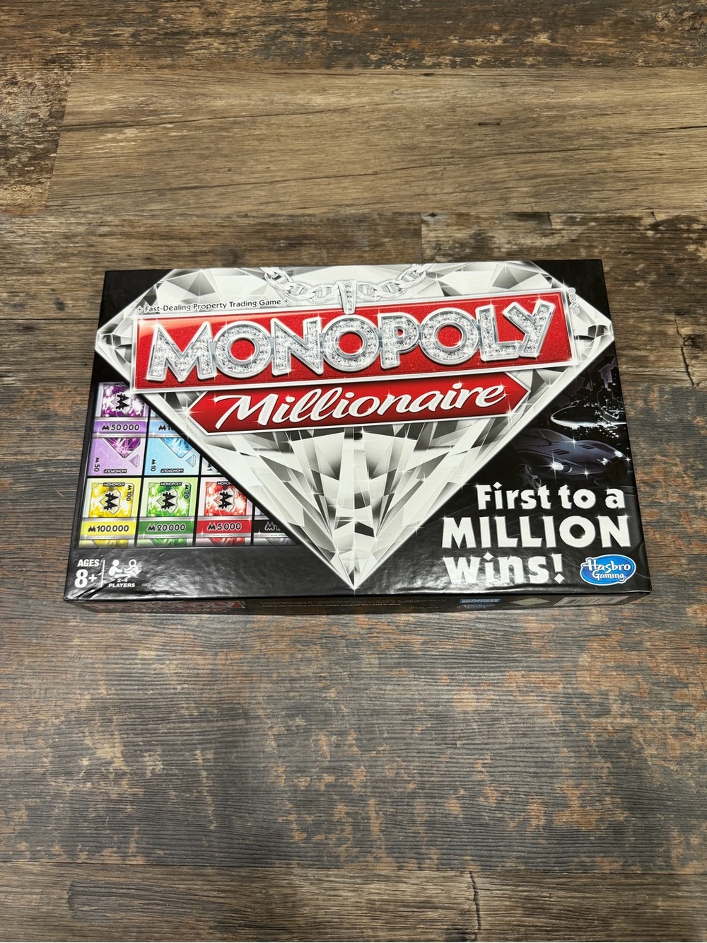 Monopoly Millionaire Board Game by Hasbro - Black & Red Box